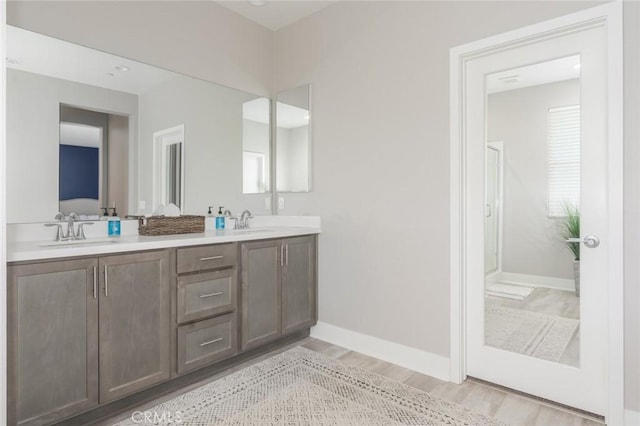 bathroom featuring vanity and hardwood / wood-style flooring