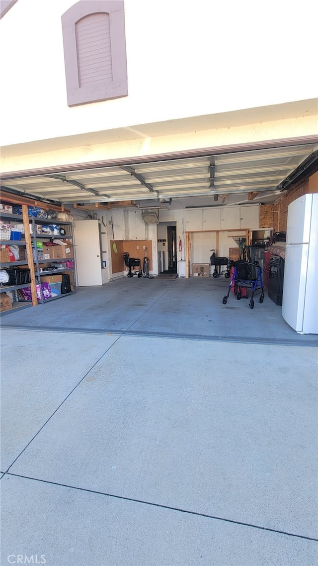 garage with white fridge