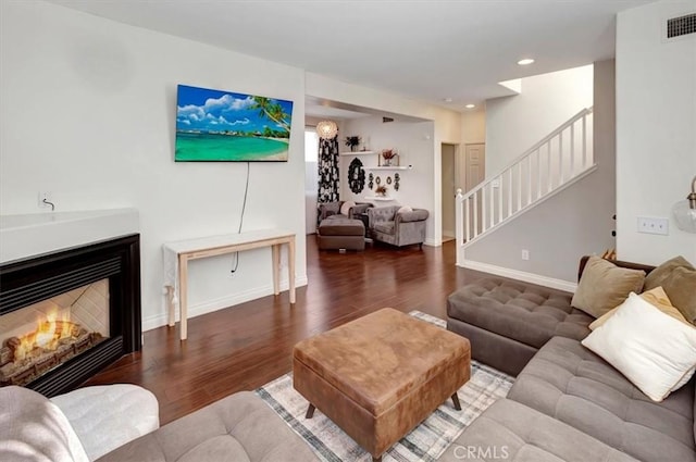 living room with dark hardwood / wood-style floors