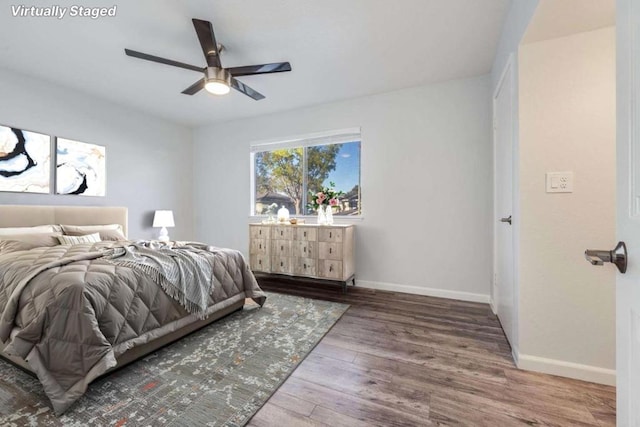 bedroom with hardwood / wood-style flooring and ceiling fan