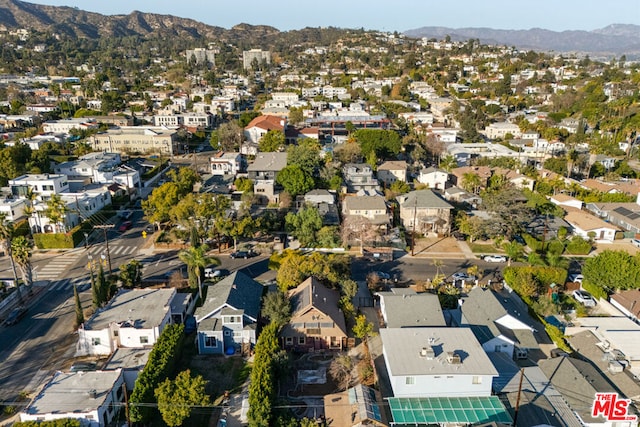 birds eye view of property with a mountain view