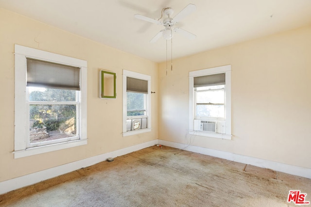 unfurnished room featuring light colored carpet, cooling unit, and ceiling fan