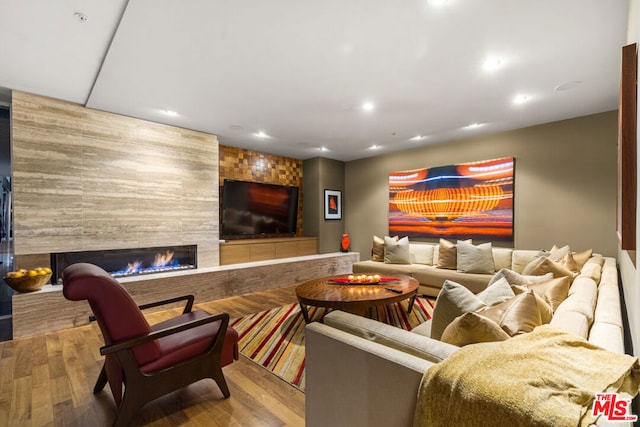 living room featuring a fireplace and hardwood / wood-style floors