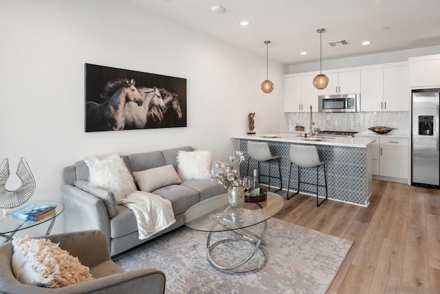 living room featuring light wood-type flooring