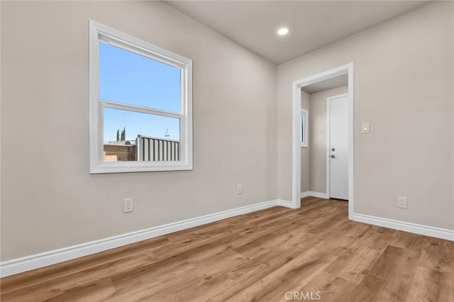 spare room featuring light hardwood / wood-style floors