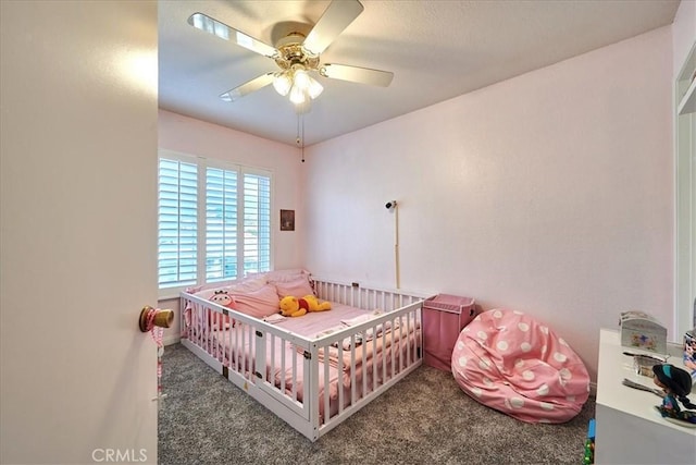 6949 Laguna Pl Unit B1, Rancho Cucamonga, CA 91701 - bedroom with a nursery area, ceiling fan, and dark carpet