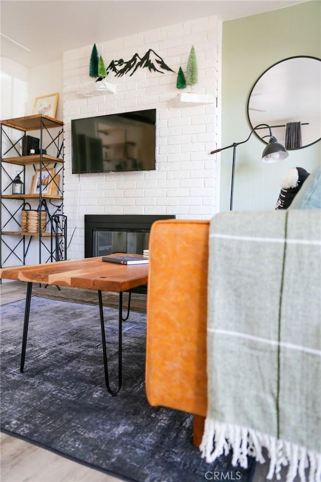 living room featuring hardwood / wood-style flooring and a fireplace