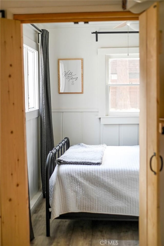 bedroom with hardwood / wood-style floors