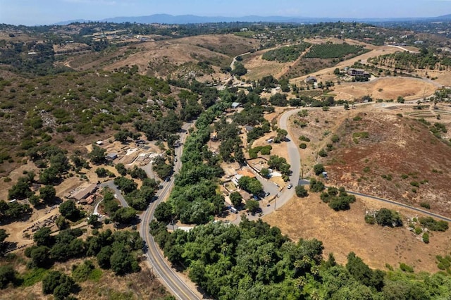 birds eye view of property featuring a mountain view