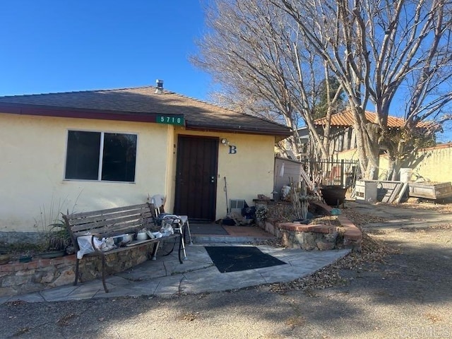 rear view of house with a patio