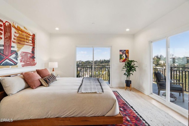 bedroom with baseboards, access to exterior, and recessed lighting