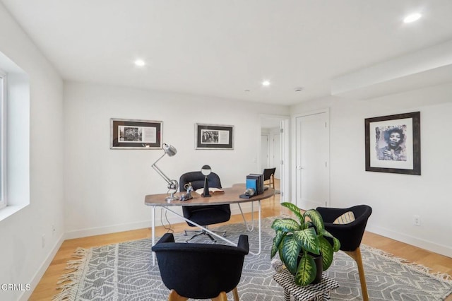 home office featuring baseboards, recessed lighting, and light wood finished floors