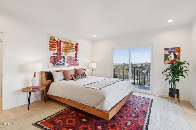 bedroom with light wood finished floors, baseboards, recessed lighting, and access to outside