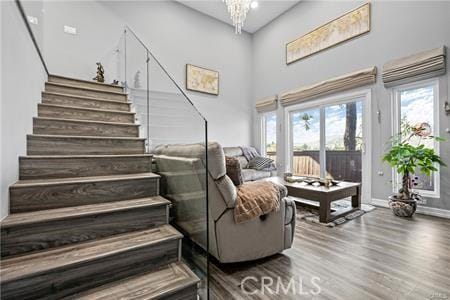 living room with hardwood / wood-style floors and a chandelier