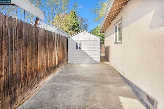 view of patio / terrace with a shed