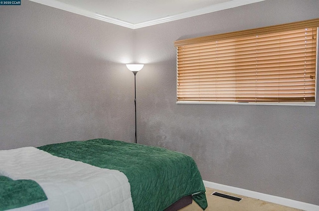 carpeted bedroom featuring ornamental molding