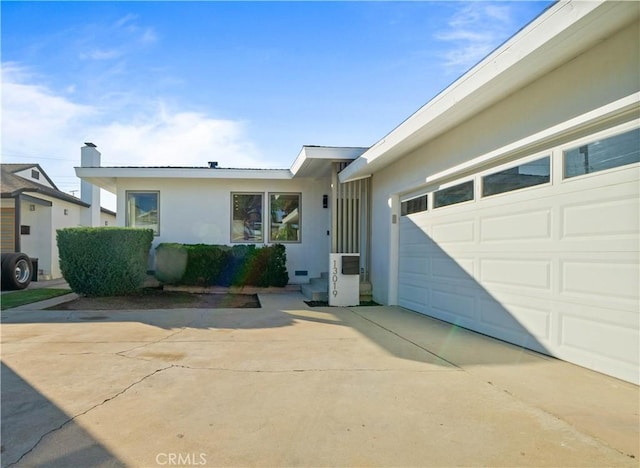 ranch-style home featuring a garage