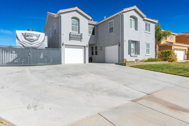 mediterranean / spanish-style house featuring a garage