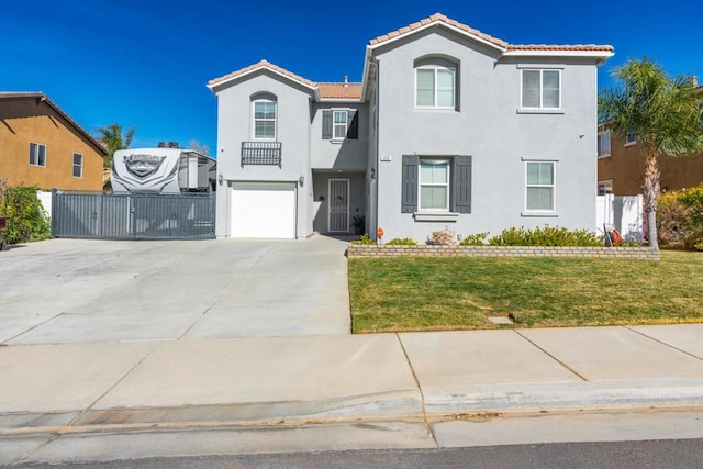 view of front of house featuring a garage and a front yard