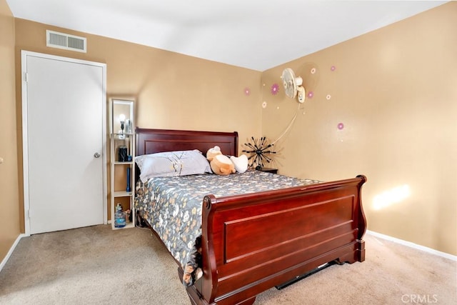 bedroom featuring light colored carpet