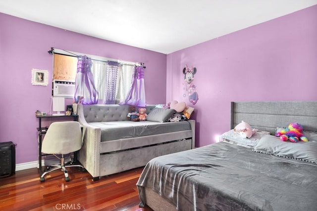 bedroom featuring dark hardwood / wood-style floors