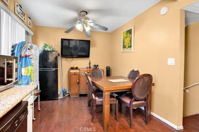 dining area featuring ceiling fan and dark wood-type flooring