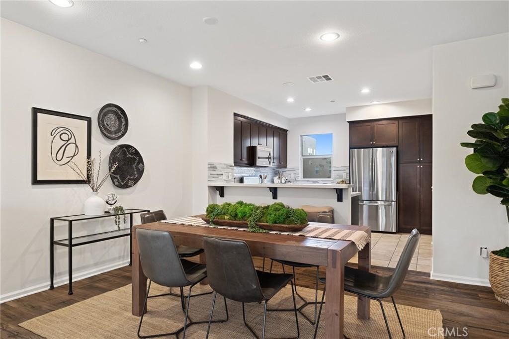 dining area with dark hardwood / wood-style floors