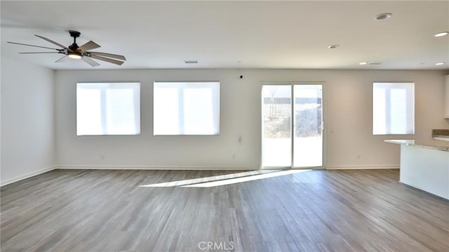 spare room with ceiling fan and hardwood / wood-style floors