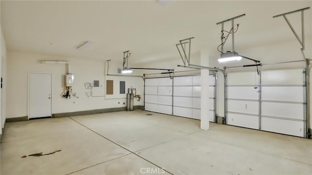 garage with a garage door opener and water heater