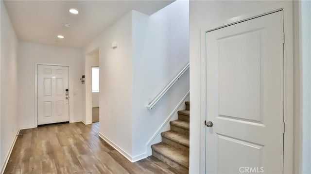 foyer entrance with light hardwood / wood-style flooring