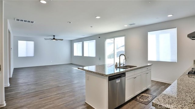 kitchen with white cabinets, sink, a kitchen island with sink, light stone counters, and stainless steel dishwasher