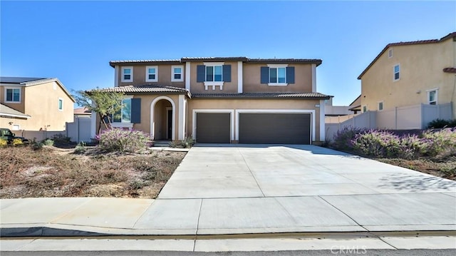 mediterranean / spanish-style home featuring a garage