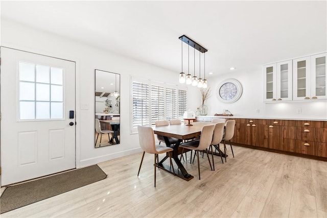 dining area with light hardwood / wood-style floors