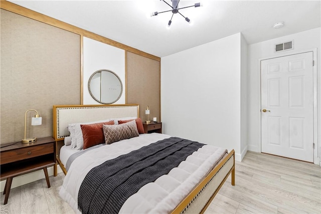 bedroom with light hardwood / wood-style floors