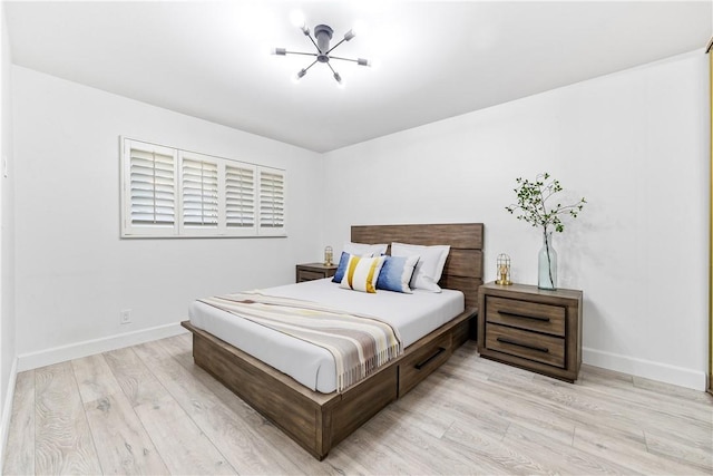 bedroom with light hardwood / wood-style floors