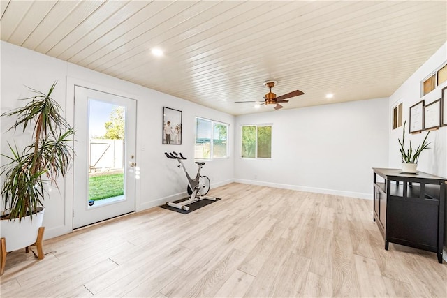 workout room featuring light wood-type flooring and ceiling fan