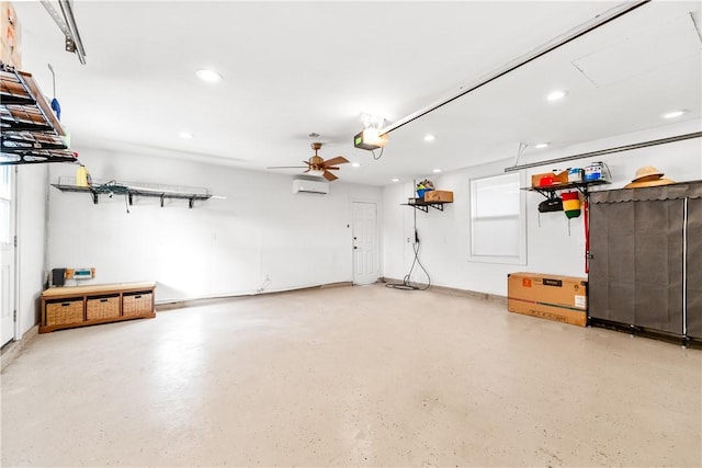 garage with ceiling fan, a wall mounted AC, and a garage door opener