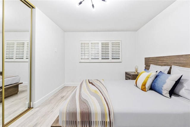 bedroom with light wood-type flooring