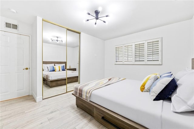 bedroom featuring a closet and light wood-type flooring