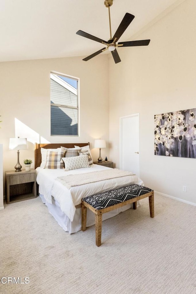 bedroom featuring ceiling fan, high vaulted ceiling, and carpet