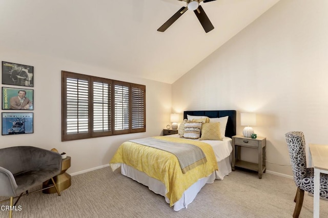 bedroom with vaulted ceiling, light colored carpet, and ceiling fan