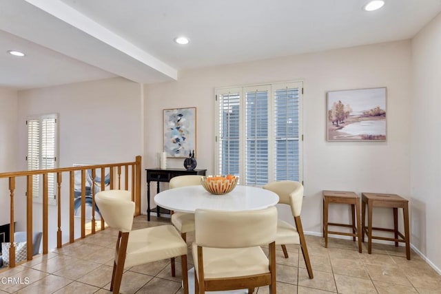 dining space featuring light tile patterned floors