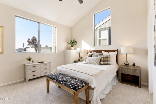 carpeted bedroom featuring vaulted ceiling and ceiling fan