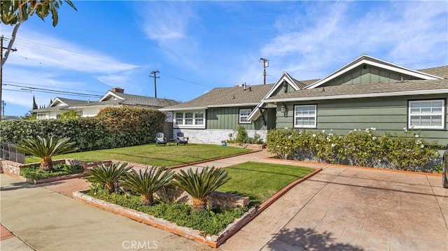 view of front of home with a front yard