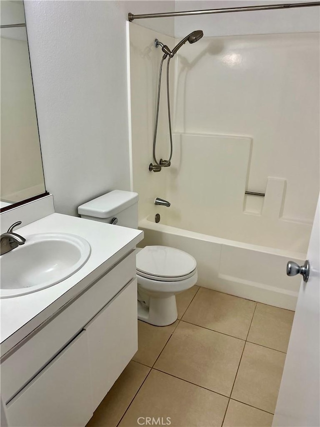 full bathroom featuring toilet, tile patterned floors, shower / washtub combination, and vanity