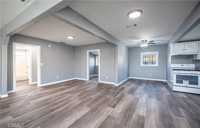 unfurnished living room featuring ceiling fan and wood-type flooring