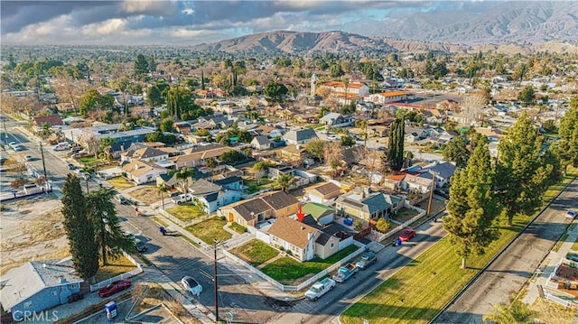 birds eye view of property with a mountain view