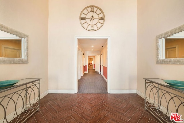 corridor with dark parquet flooring