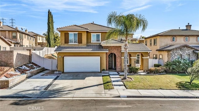 view of front of property with a garage and a front lawn