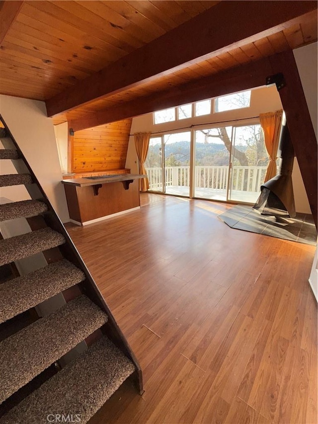 bonus room with wood ceiling, hardwood / wood-style flooring, and beam ceiling